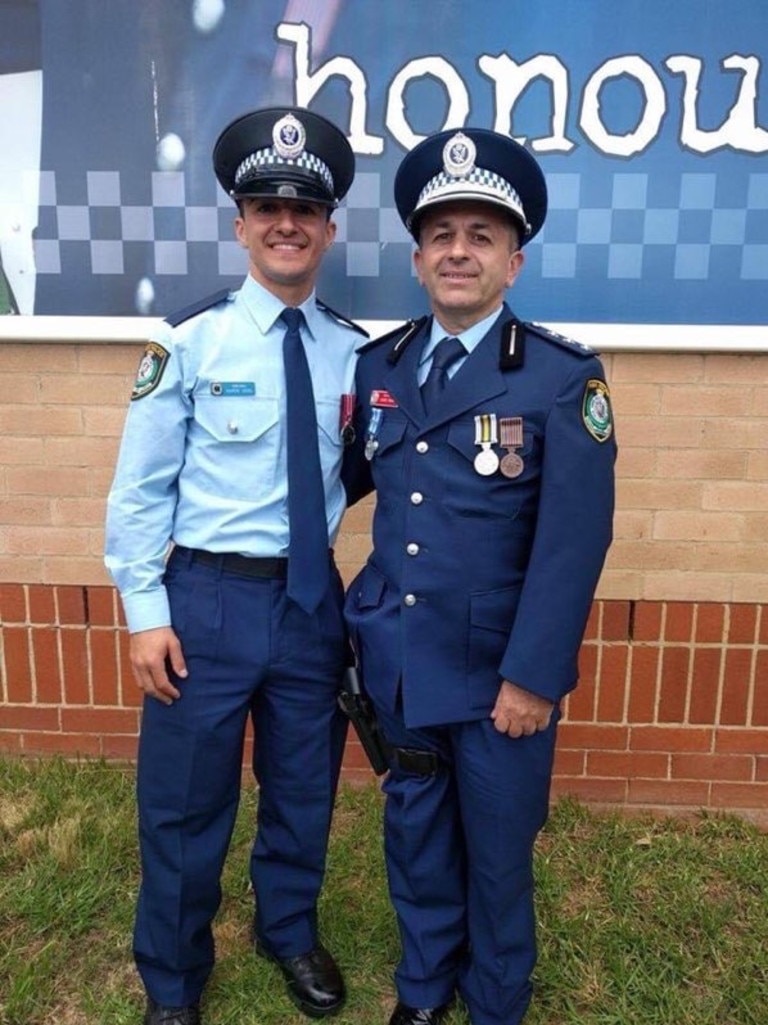 Constable Aaron Vidal (L) with his father, Chief Inspector David Vidal.