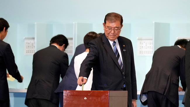 Shigeru Ishiba casts his ballot in Tokyo on Friday. Picture: AFP