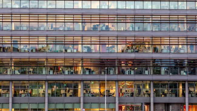 Lights illuminate offices at the PricewaterhouseCoopers LLP (PwC) building in Dublin, Ireland, on Thursday, Oct. 15, 2020. Office vacancy rate rose from 6.65% at end of the second quarter to 8.64% at end of the third quarter, CBRE Group Inc. said. Photographer: Patrick Bolger/Bloomberg