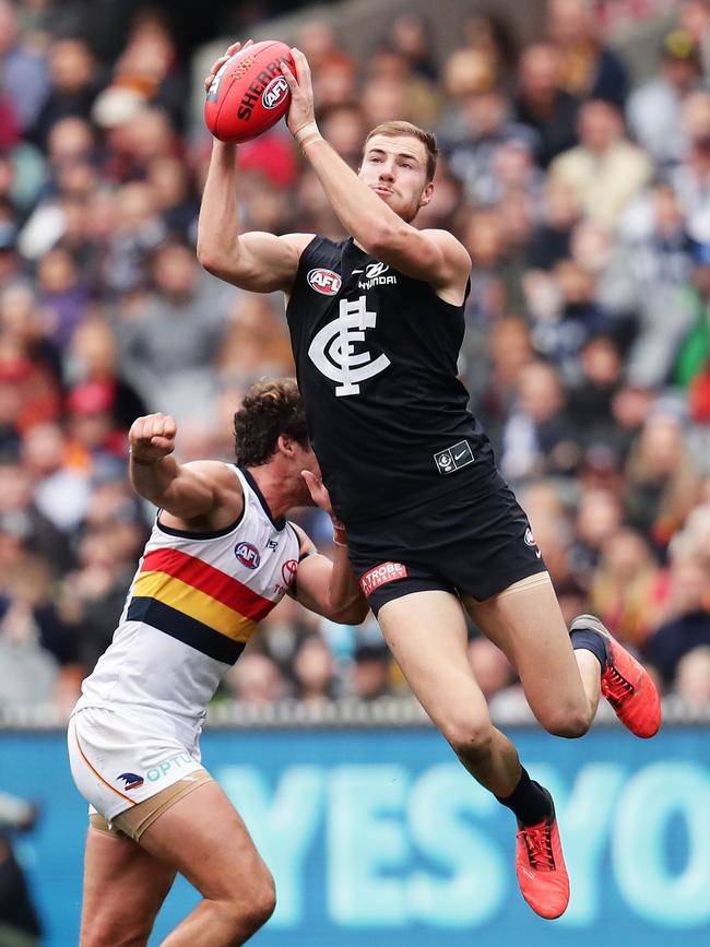 Carlton’s Harry McKay marks in front of Adelaide defender Kyle Hartigan in Round 19. Picture: Matt King/Getty