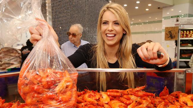 Gina Vuletich buying her Christmas prawns at De Costi seafood at the Fish Markets. Picture: Adam Taylor