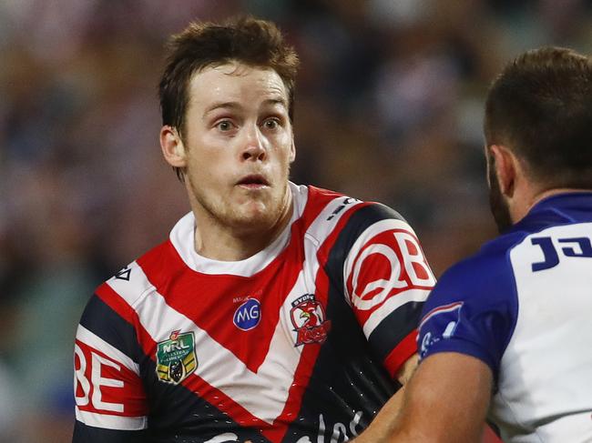 Luke Keary of the Roosters tries to evade Matthew Frawley of the Bulldogs during the Round 2 NRL match between the Sydney Roosters and the Canterbury-Bankstown Bulldogs at Allianz Stadium in Sydney, Friday, March 16, 2018. (AAP Image/Daniel Munoz) NO ARCHIVING, EDITORIAL USE ONLY