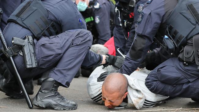 "Millions March against mandatory Covid vaccinations" Rally organised by a group dubbed "Health Rights Alliance" in Flagstaff Gardens Melbourne. Police arrest a group in North Melbourne after walking away from the park. Picture: Alex Coppel.