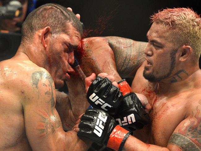 BRISBANE, AUSTRALIA - DECEMBER 07: Mark Hunt connects with an elbow during the UFC Brisbane bout between Mark Hunt and Antonio 'Big Foot' Silva of Brazil at the Brisbane Entertainment Centre on December 7, 2013 in Brisbane, Australia. (Photo by Bradley Kanaris/Getty Images)