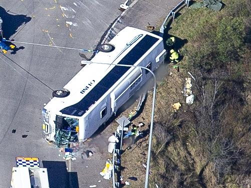 **ATTENTION EDITORS: Image contains graphic content** This image has blood and possible bodies blurred HUNTER VALLEY, AUSTRALIA - NCA NewsWire Photos - 12 JUNE, 2023: Aerial scene coverage from the site where ten people have died, and 11 people were hospitalised after a bus carrying wedding guests crashed in the Hunter Valley., Picture: NCA NewsWire / Christian Gilles