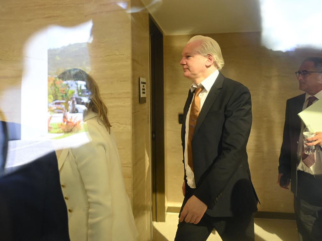 Julian Assange walks through the US Federal Courthouse in Saipan ahead of his hearing. Picture: AFP