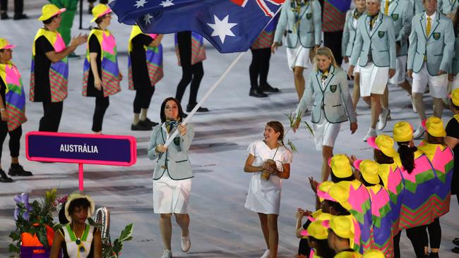 RIO DE JANEIRO, BRAZIL — AUGUST 05: Anna Meares of Australia carries the flag during the Opening Ceremony of the Rio 2016 Olympic Games at Maracana Stadium on August 5, 2016 in Rio de Janeiro, Brazil. (Photo by Clive Brunskill/Getty Images)