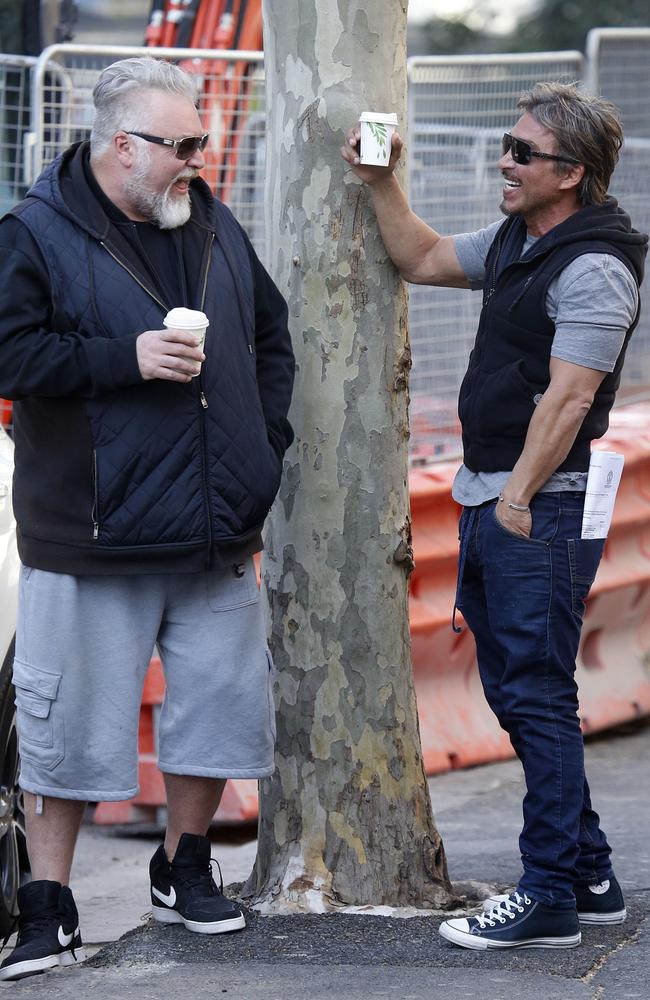 John Ibrahim is seen with Kyle Sandilands in Kings Cross, where at the same time Ibrahim’s Dover Heights home was being raided by police. Picture: Matrix