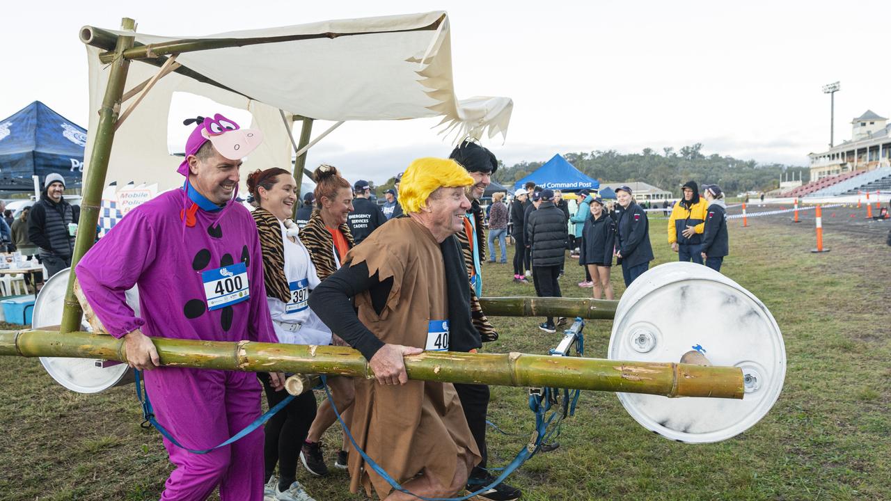 Yabba Dabba Doo team with the Flintmobile are (from left) Simon King, Rachel McNaughton, Dayle Needham, Brett Ebneter and Dale McNaughton, absent (on course) is Lisa Salisbury, at 40 for Fortey at Toowoomba Showgrounds, Sunday, June 2, 2024. Picture: Kevin Farmer