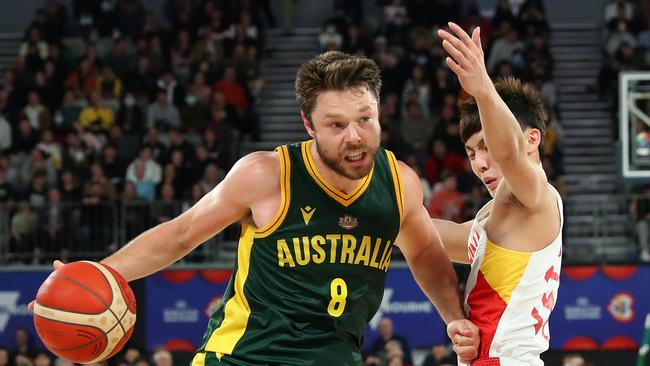 Matthew Dellavedova (c) of Australia dribbles the ball against Jie Xu of China during the FIBA World Cup Asian Qualifier match between the Australia Boomers and China at John Cain Arena. (Photo by Kelly Defina/Getty Images)