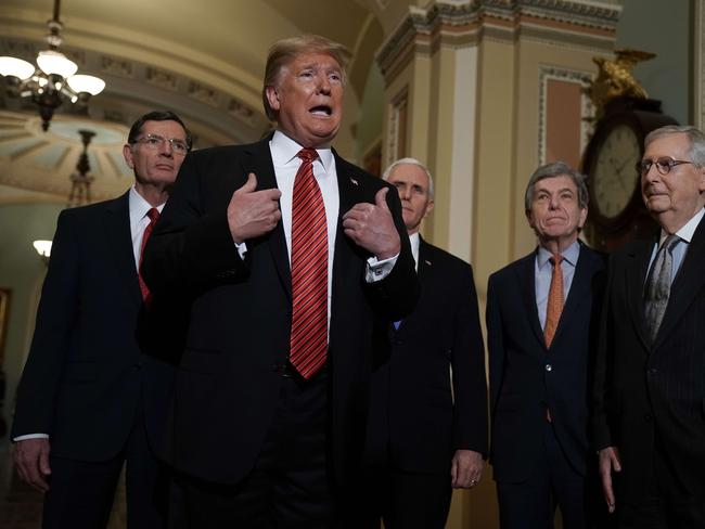 WASHINGTON, DC - JANUARY 09: U.S. President Donald Trump (2nd L) speaks to members of the media as (L-R) Sen. John Barrasso (R-WY), Vice President Mike Pence, Sen. Roy Blunt (R-MO), and Senate Majority Leader Sen. Mitch McConnell (R-KY) listen at the U.S. Capitol after the weekly Republican Senate policy luncheon January 09, 2019 in Washington, DC. Trump met with GOP lawmakers to shore up their resolve and support for his proposed border wall with Mexico as the partial federal government shutdown drags into a third week.   Alex Wong/Getty Images/AFP == FOR NEWSPAPERS, INTERNET, TELCOS & TELEVISION USE ONLY ==