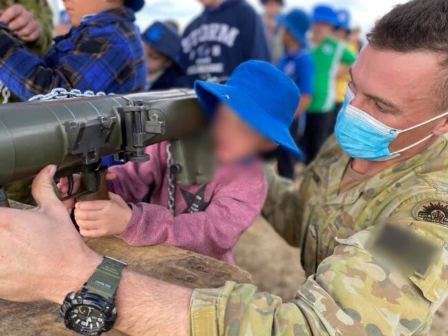 Children as young as six play with heavy weapons as part of ADF community engagement in Gayndah. Photo/Twitter.