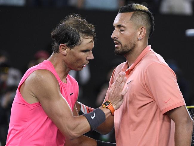 Spain's Rafael Nadal, left, is congratulated by Australia's Nick Kyrgios after winning their fourth round singles match at the Australian Open tennis championship in Melbourne, Australia, Monday, Jan. 27, 2020. (AP Photo/Andy Brownbill)