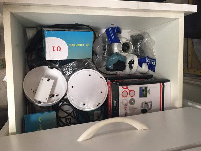 Inside the secret shed, police found laptops, cameras, recording equipment, USB drives and SD cards and another hidden camera disguised as a smoke detector. Picture: NSW Police