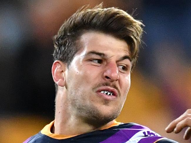 Curtis Scott (left) of the Storm palms off Blake Ferguson (right) of the Eels during the Round 9 NRL match between the Melbourne Storm and the Parramatta Eels at Suncorp Stadium in Brisbane, Saturday, May 11, 2019. (AAP Image/Darren England) NO ARCHIVING, EDITORIAL USE ONLY