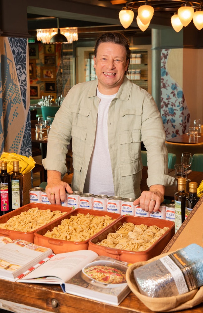 Jamie inside his restaurant on-board Ovation of the Seas, posing alongside one of his favourite foods – pasta. Picture: Rocket Weijers/Getty Images