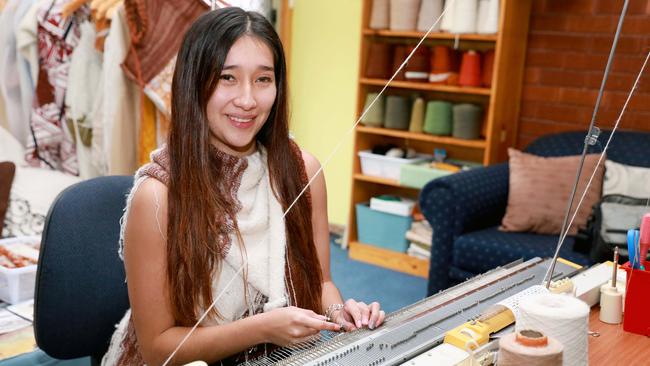 Susan at her knitting machine. Picture: Angelo Velardo