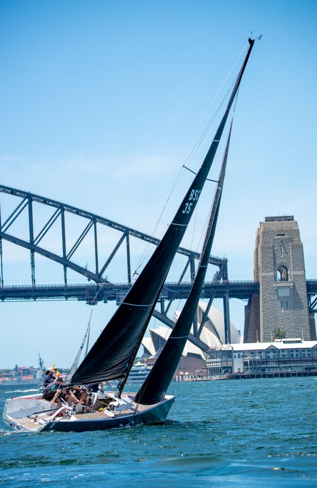 A boat tacts around Sydney Harbour. Picture: Thomas Lisson