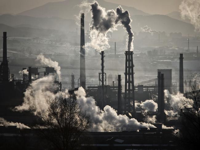 Water vapour and smoke rise from a steel plant in China. Picture: Qilai Shen/Bloomberg