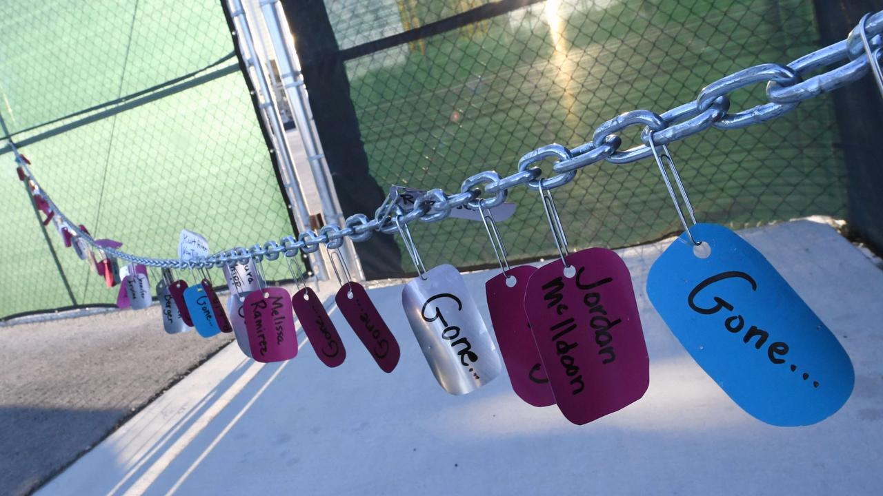 Tags bearing the names of those killed in a massacre almost two years ago are attached to a chain-link fence with paperclips outside the Las Vegas Village across from Mandalay Bay. Picture: Getty Images