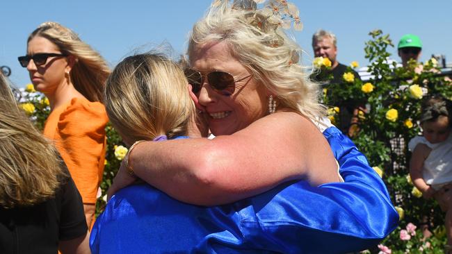 Jamie Kah receives a hug from Dean Holland mum Belinda. Picture: Vince Caligiuri/Getty Images