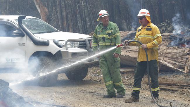 Michael Cassey, of Sustainable Timber Tasmania, and Justin Fashion, of Ground Proof Mapping bushfire management consultancy, in consolidation mode near Geeveston today. Picture: RICHARD JUPE