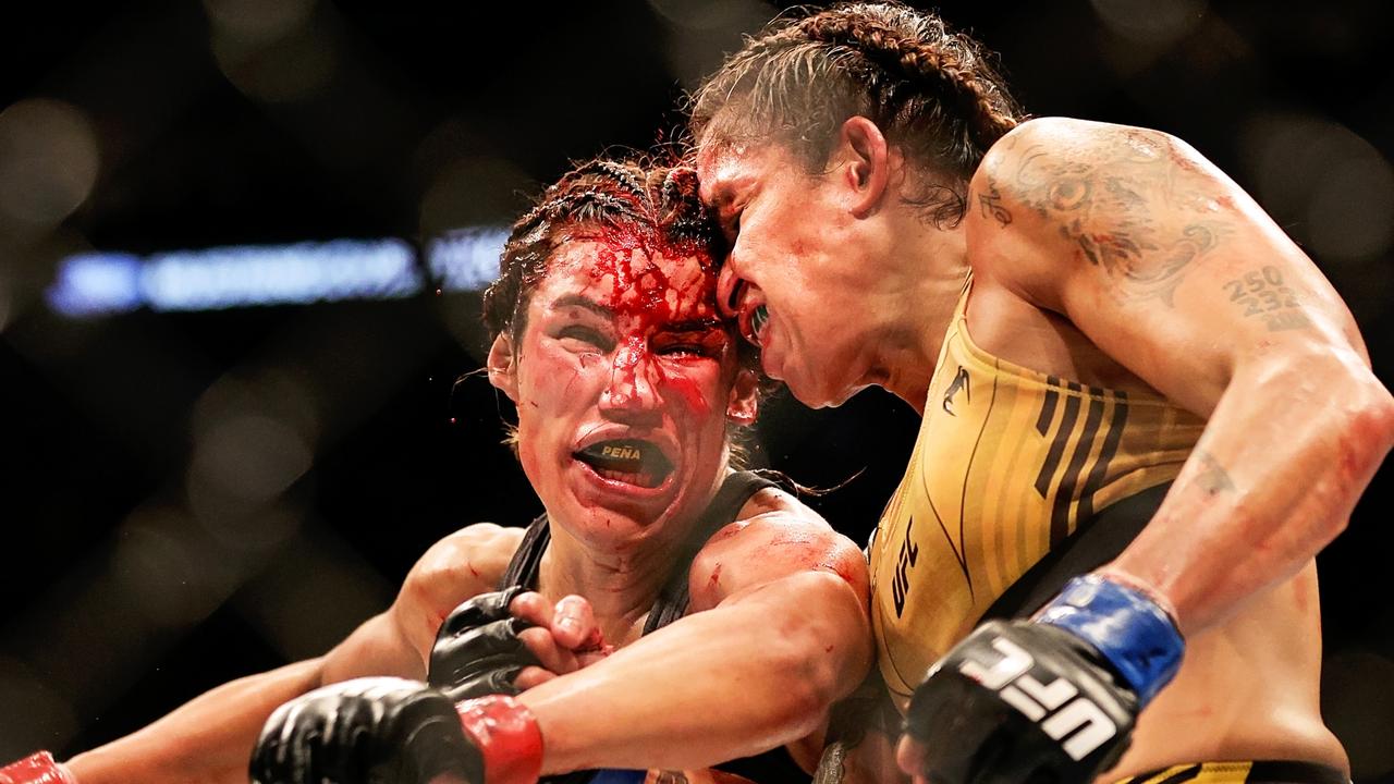 DALLAS, TEXAS - JULY 30: Amanda Nunes of Brazil exchanges strikes with Julianna Pena in their bantamweight title bout during UFC 277 at American Airlines Center on July 30, 2022 in Dallas, Texas. (Photo by Carmen Mandato/Getty Images)