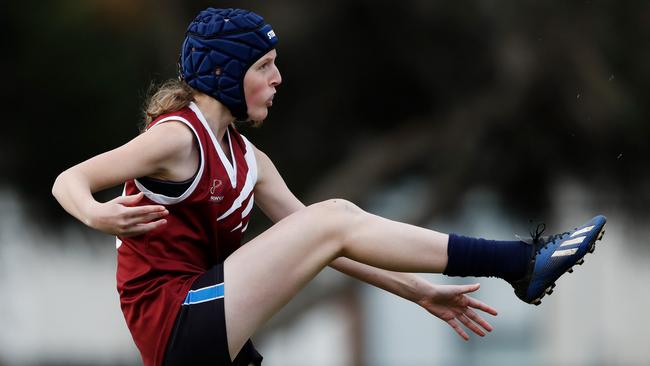 Sienna Walker of Rowville Secondary kicks the ball. Picture: Dylan Burns/AFL Photos via Getty Images