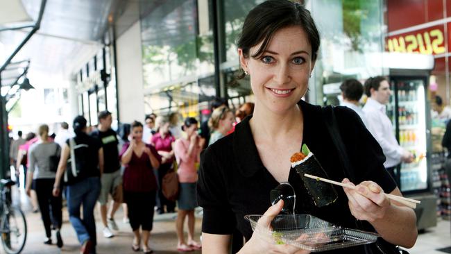 Michelle Nelson of Indoroopilly doesn’t mind the wait to get her hands on a sushi roll from LR Sushi in the Brisbane CBD.