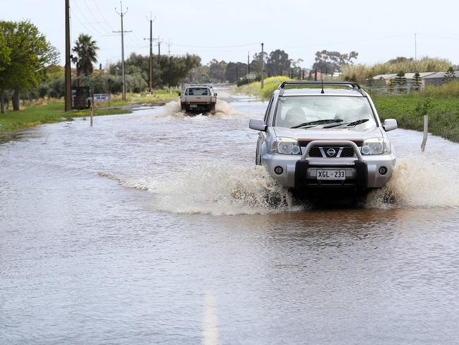 Cars cross flood waters at Virginia. Pic: Calum Robertson