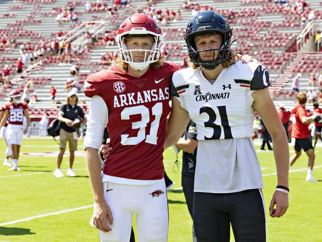 Brothers Mason Fletcher #31 of the Cincinnati Bearcats and Max Fletcher #31 of the Arkansas Razorbacks before the game. Picture: Wesley Hitt/Getty Images/AFP