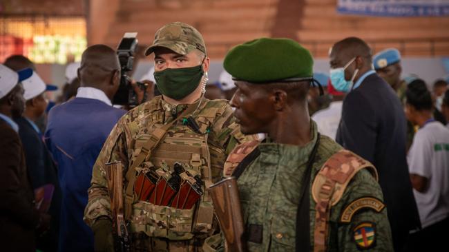 A solder from the Russian group Wagner, left, stands next to a Central African Republic soldier in the city of Bangui on March 18. Picture: AFP