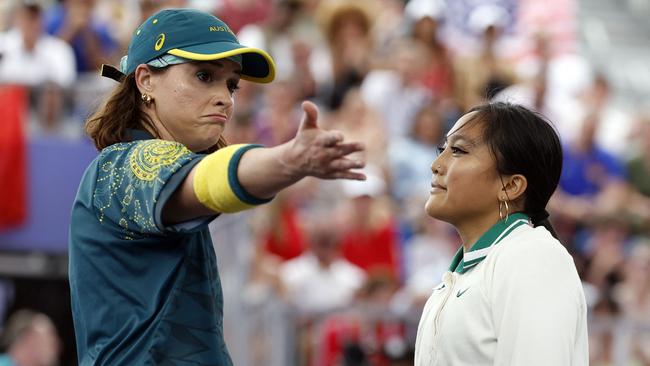 Australia's Rachael Gunn gestures next to Logan Edra, known as Logistx. Photo by Odd ANDERSEN / AFP.