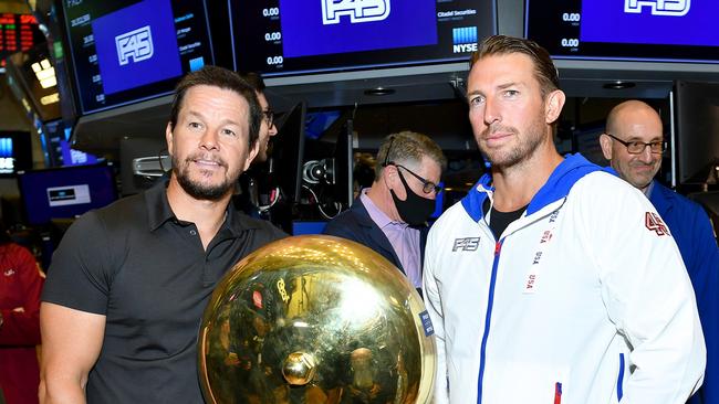 Actor Mark Wahlberg (left) and F45 founder and chief executive Adam Gilchrist on the trading floor at the New York Stock Exchange. Picture: Noam Galai / Getty Images for F45 Training