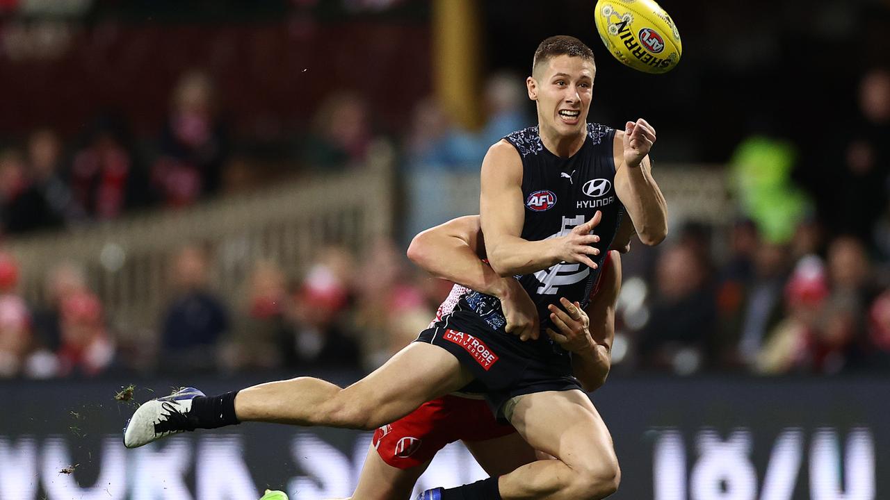 Lachie Fogarty is brought down in a Sydney tackle.