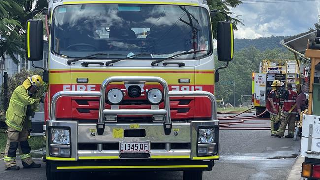 Firefighters in action at a house fire in Machans Beach on the Barron River Esplanade, February 2, 2023. Picture: Alison Paterson