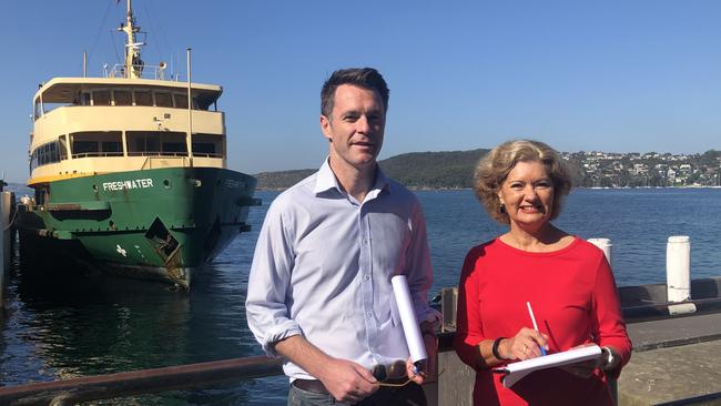 Shadow Transport Minister Chris Minns and Cr Candy Bingham, in front of one of Manly's iconic Freshwater class ferries, which will soon disappear under a shake-up of ferry services. Picture: Julie Cross