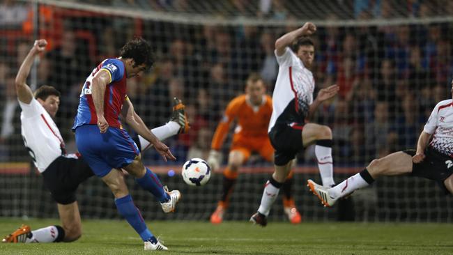 Jedinak tests Liverpool with a long range bomb.