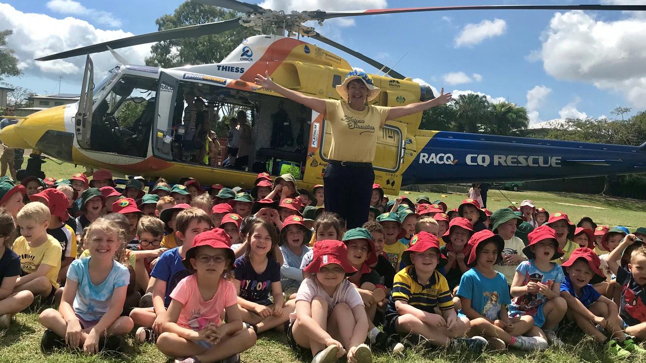 SPECIAL DELIVERY: Teacher librarian Helen Taylor, who was rescued by RACQ CQ Rescue chopper, with Eimeo Road State School preppies.