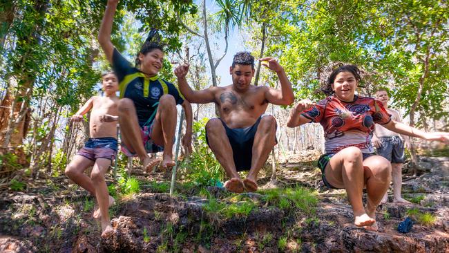 Sharma Ah-Wing, Cieanna Ah-Wing, Ronald Ah-Wing and Chanelle Ah-Wing jump into Buley Rockhole in Litchfield National Park. Picture: Che Chorley