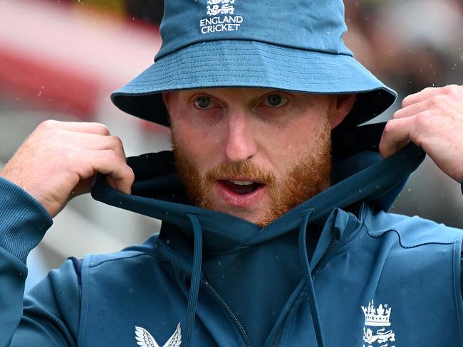 MANCHESTER, ENGLAND - JULY 23: Ben Stokes of England arrives for the end of match presentations as he shelters from the rain on day five of the LV=Insurance Ashes 4th Test Match between England and Australia  at Emirates Old Trafford on July 23, 2023 in Manchester, England. (Photo by Clive Mason/Getty Images)