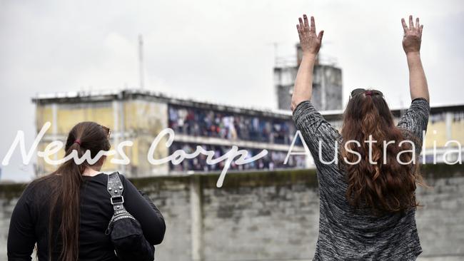 Cassandra Sainsbury's mother and sister behind the jail El Buen Pastor in Bogota. Picture: Guillermo Legaria