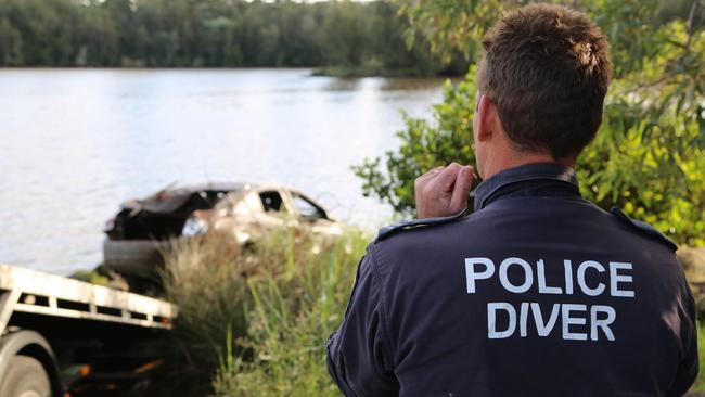 Police recover a car from the Georges River on April 6 last year, as part of a Strike Force Ravens investigation. Picture: NSW Police