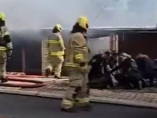 A police officer has been taken to hospital, while a woman has been detained after a house fire at Athelstone. Picture: 7NEWS Adelaide