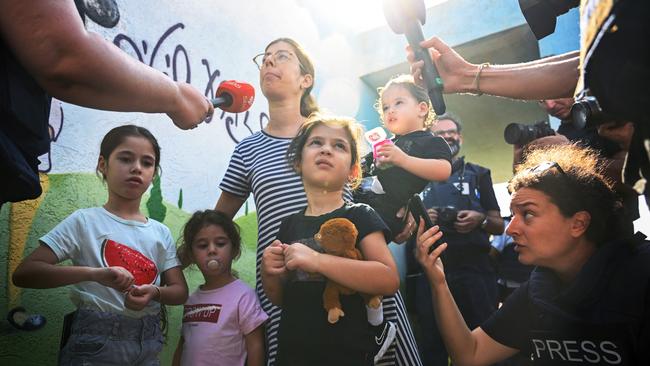 Families arrive with suitcases to busses after evacuation orders are issued on October 15, 2023 in Sderot, Israel. Picture: Alexi J. Rosenfeld/Getty Images