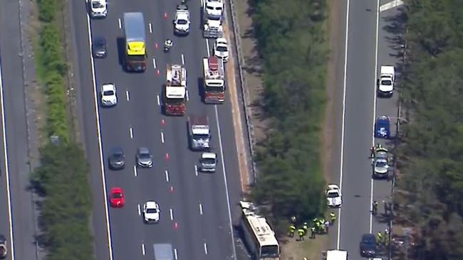 Multiple people have been taken to hospital after a collision between a bus and semitrailer on the M1. Picture: Supplied / Channel 9
