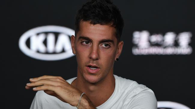 Thanasi Kokkinakis speaks to the media after retiring from the Australian Open last night. Picture: AAP