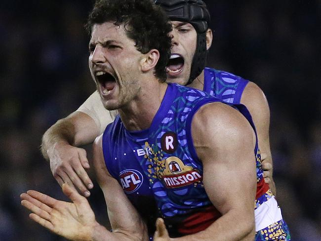 AFL - Western Bulldogs v West Coast Eagles at Etihad Stadium, Western Bulldogs Tom Liberatore kicks a goal in the last quarter to seal the win for the Dogs as Luke Shuey looks on. . 5th June 2016. Picture: Colleen Petch.