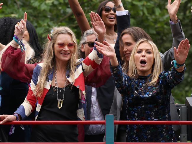 Kate Moss, Naomi Campbell, Charlotte Tilbury and Patsy Kensit ride a bus along the mall during the Platinum Pageant. Picture: Getty Images