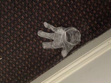 A discarded PPE glove found in one of the rooms at the Rydges.